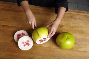 Next, score the peel with a knife or peeler in sixths or eighths, being careful not to cut into the fruit itself. 