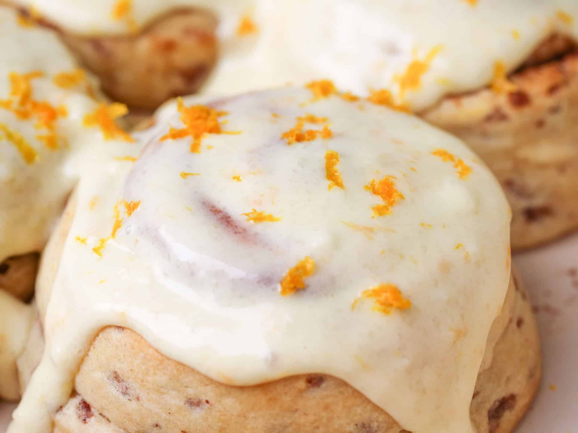 Cinammon roll with orange cream cheese frosting