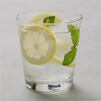 Glass of water with citrus and mint